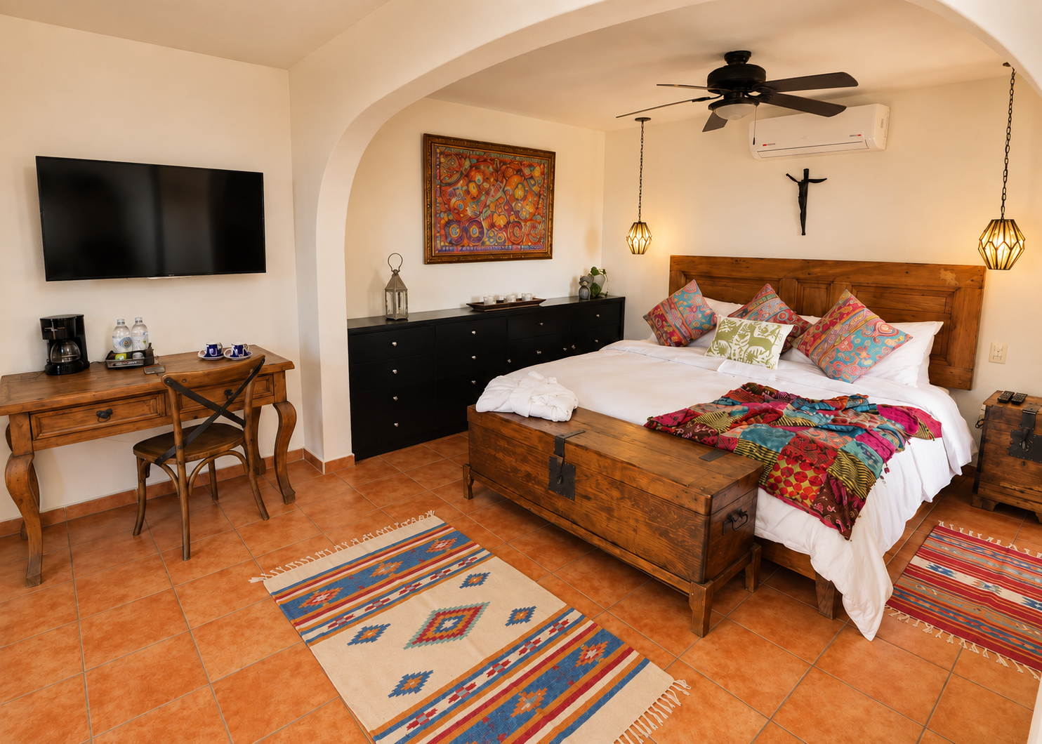 Grand Master Suite with handcrafted wood furniture and colorful Mexican textiles
