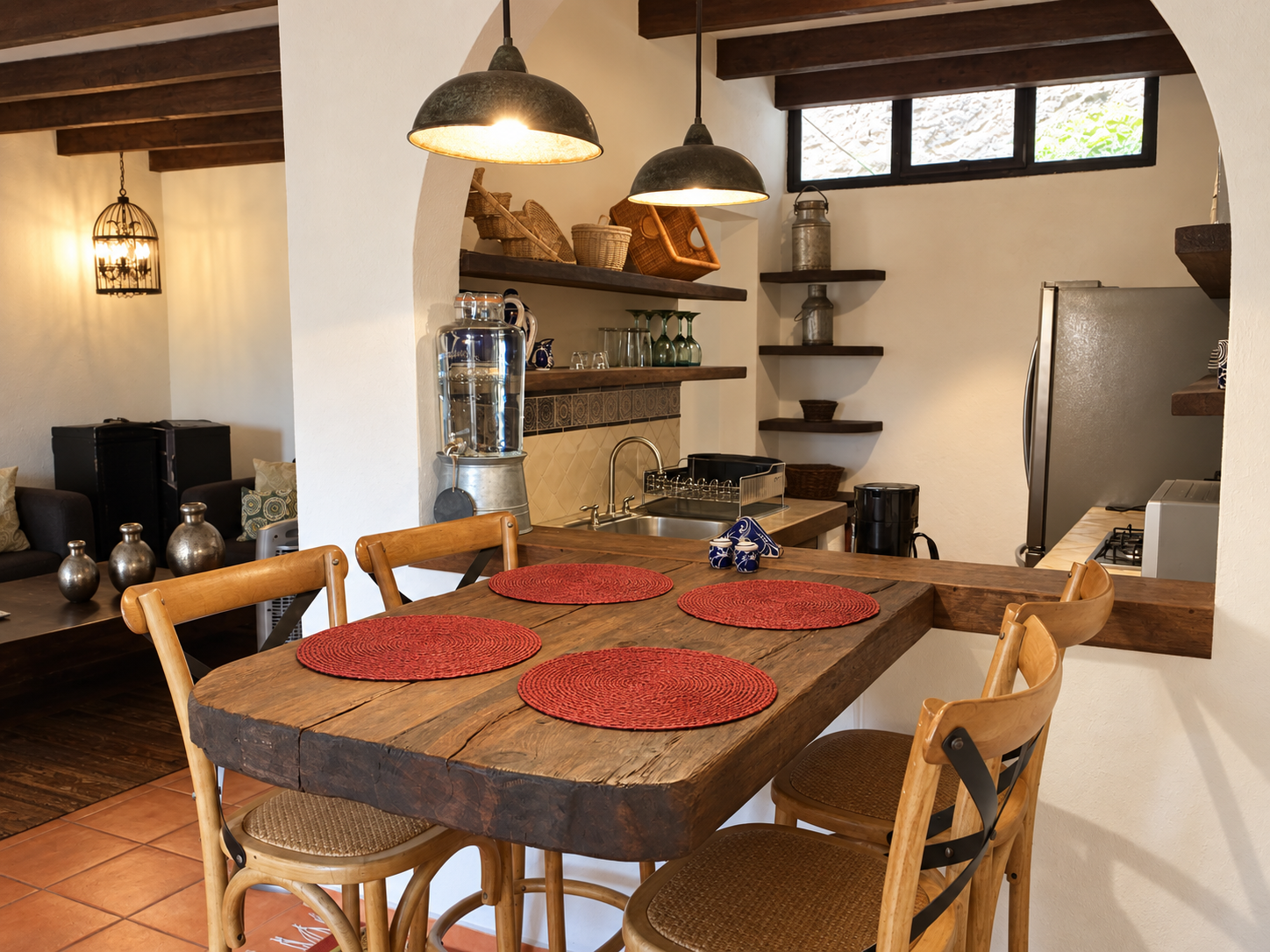 A fully equipped suite kitchen and dining area at Casa Mia