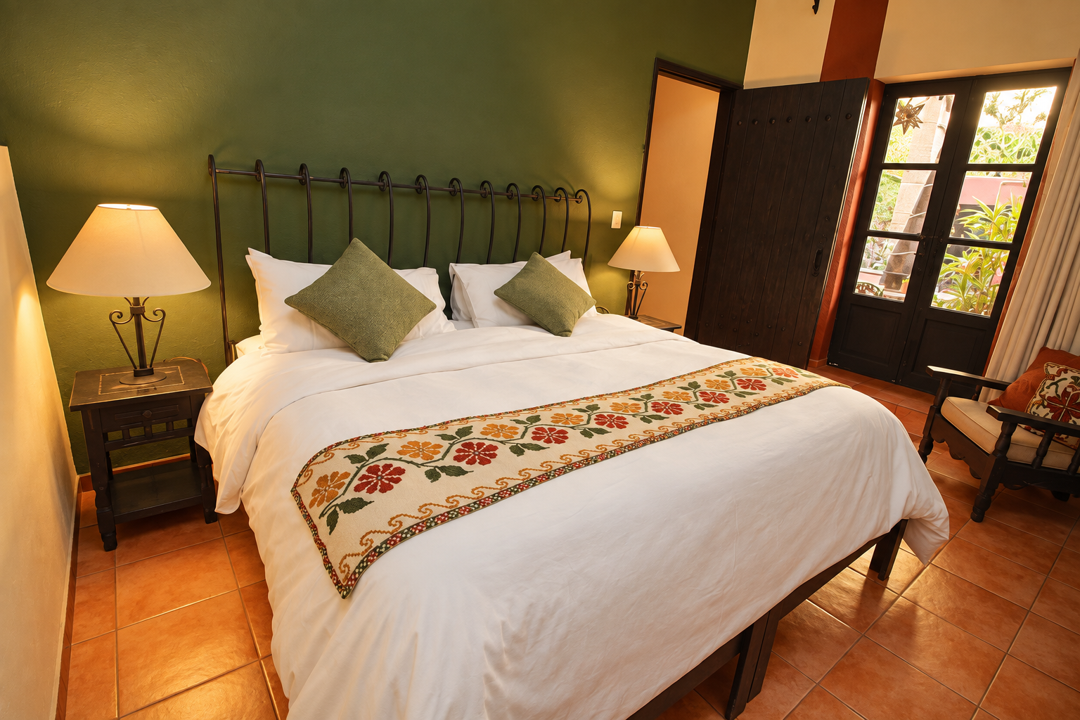 Deluxe King Suite with embroidered textiles and garden light
